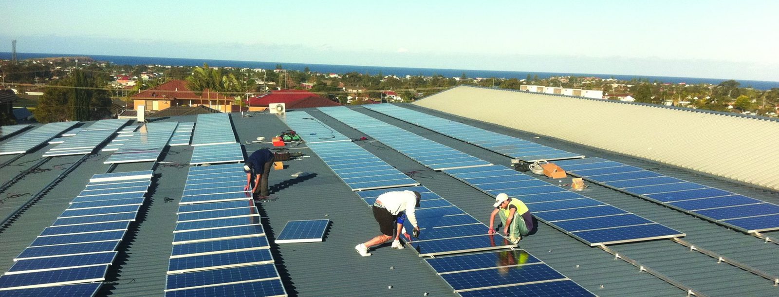 Large commercial roof with solar installation underway