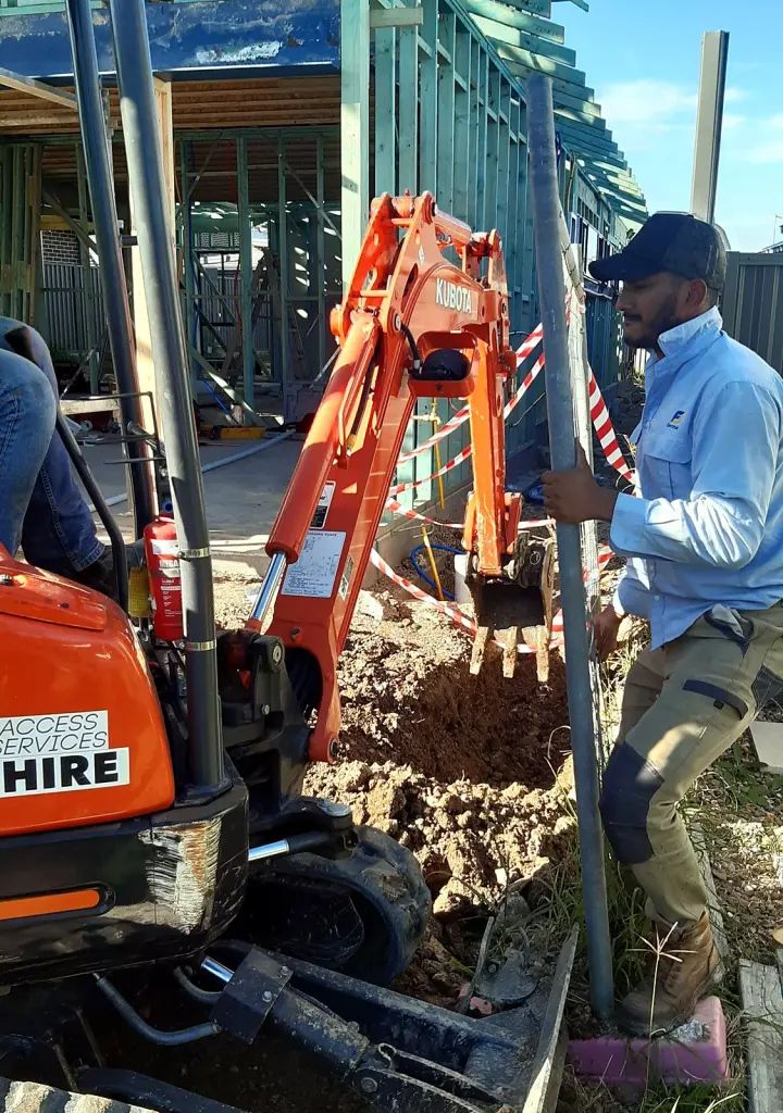 FJ electrician digging a trench for an underground power supply